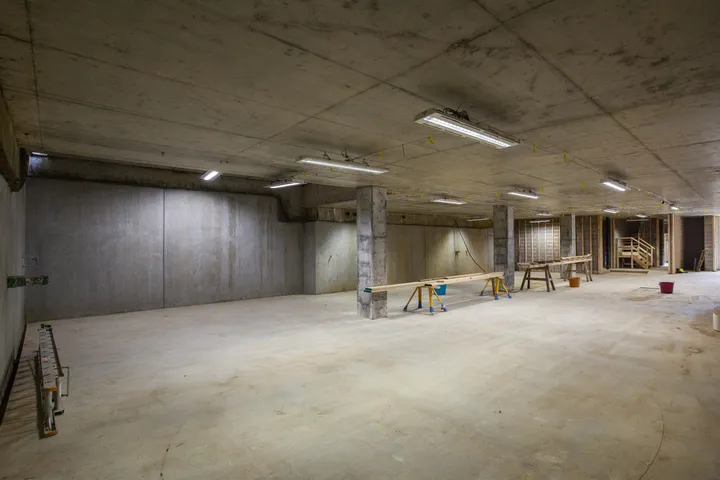 Completed concrete basement structure before fitout, with clear spans and finished slab
