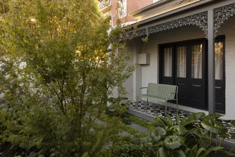 Joy Terrace, South Yarra, living room opening to green courtyard, heritage renovation by TCON
